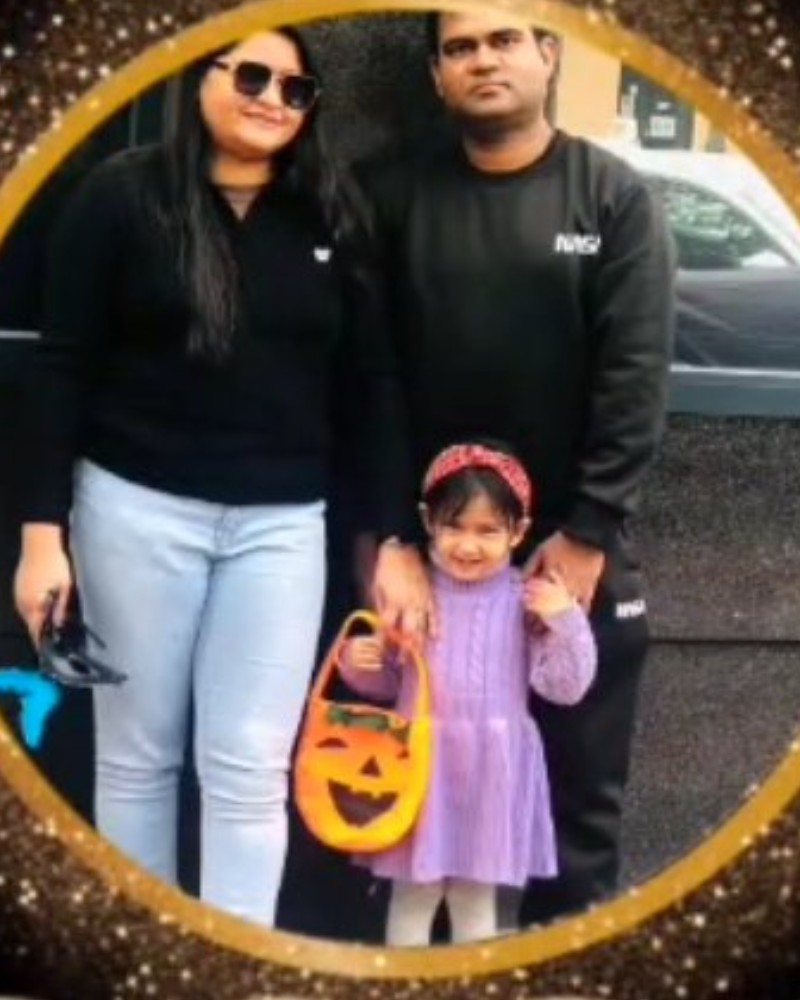Picxson with his wife and daughter at the shop